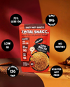 A package of Total Snacc Super Bhujia snack is shown against a split dark red and orange background with several black circular callout badges highlighting product benefits like plant protein, low GI, and roasted not fried.