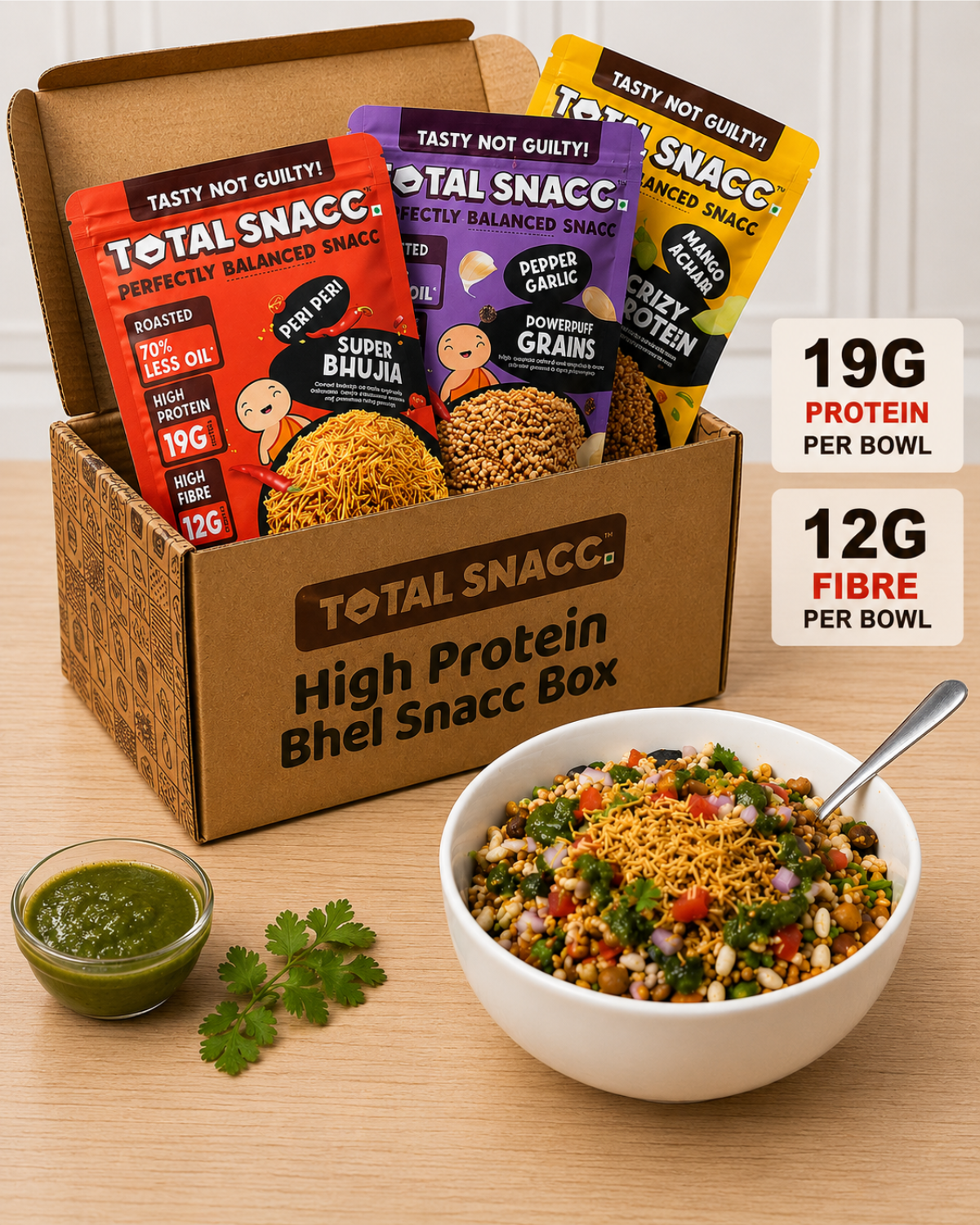 Total Snacc high protein bhel snacc box with various snack packets and a bowl of bhel on a wooden surface.